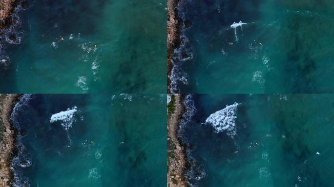 海中冲浪板上冲浪者的鸟瞰图。Ghajn Tuffieha海滩。欧洲。马尔他岛
