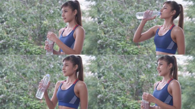 健身女子独自在家进行极限运动后喝水