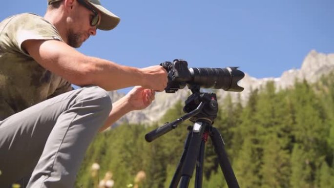 男性使用专业相机拍摄户外照片
