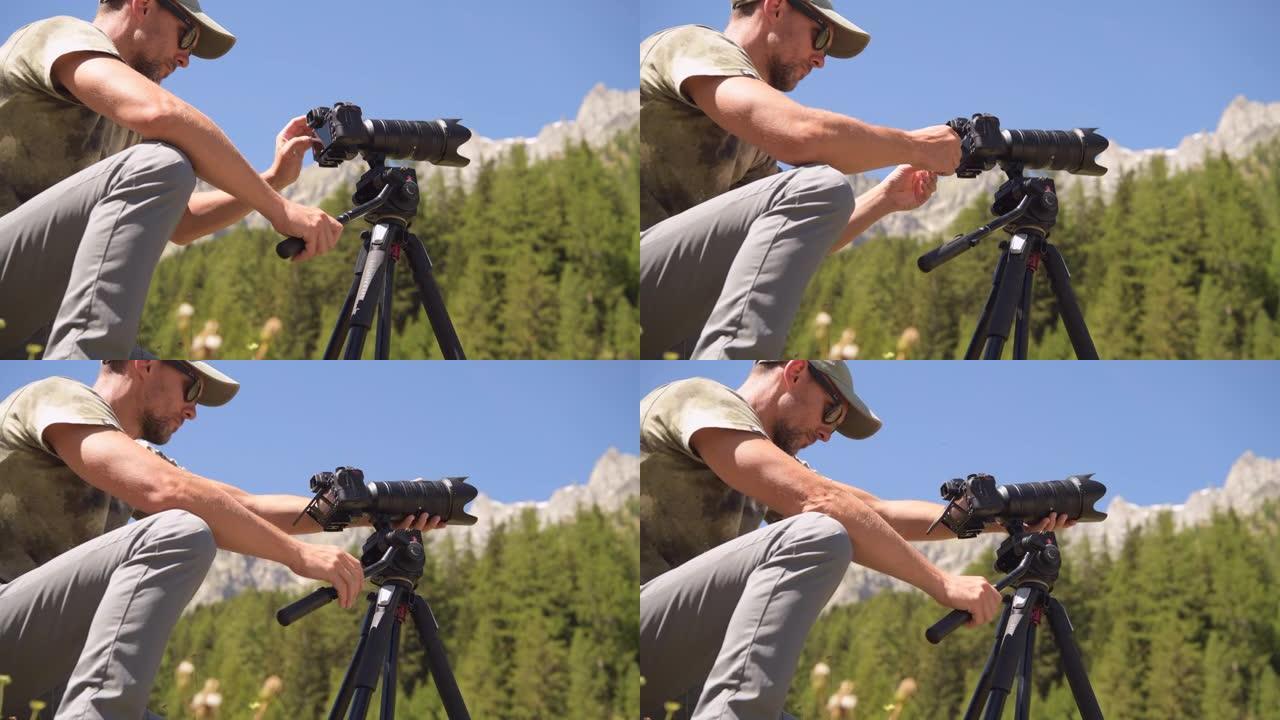 男性使用专业相机拍摄户外照片