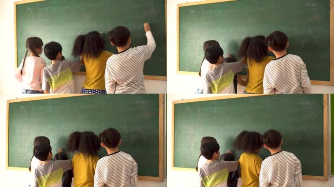 小学生在黑板上写作