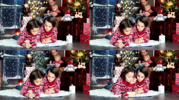 幸福的微笑家庭，妈妈，爸爸和三个男孩，在圣诞节假期在家中拥有全家福