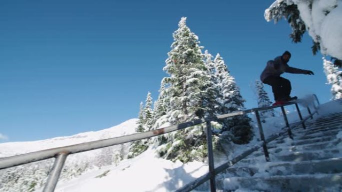 单板滑雪射击职业单板滑雪运动员滑行一个激动人心的扶手障碍完成了一个被称为5050的技巧在极端冬季运动