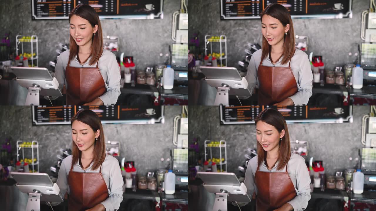 在她的小咖啡店工作的亚洲咖啡师的肖像。新的正常创业小企业