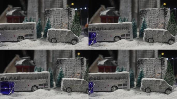 冬天晚上在雪地里装饰可爱的小房子，圣诞节和新年晚上在雪地里用枞树微型房子。假日概念。选择性聚焦