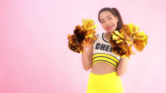 彩色背景上的年轻亚洲女性啦啦队长