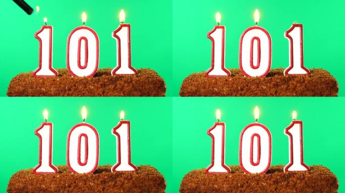 蛋糕与数字101点燃的蜡烛。色度键。绿屏。隔离