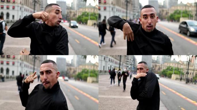 西班牙裔男子在外面的街道上跳舞，对着镜头表演