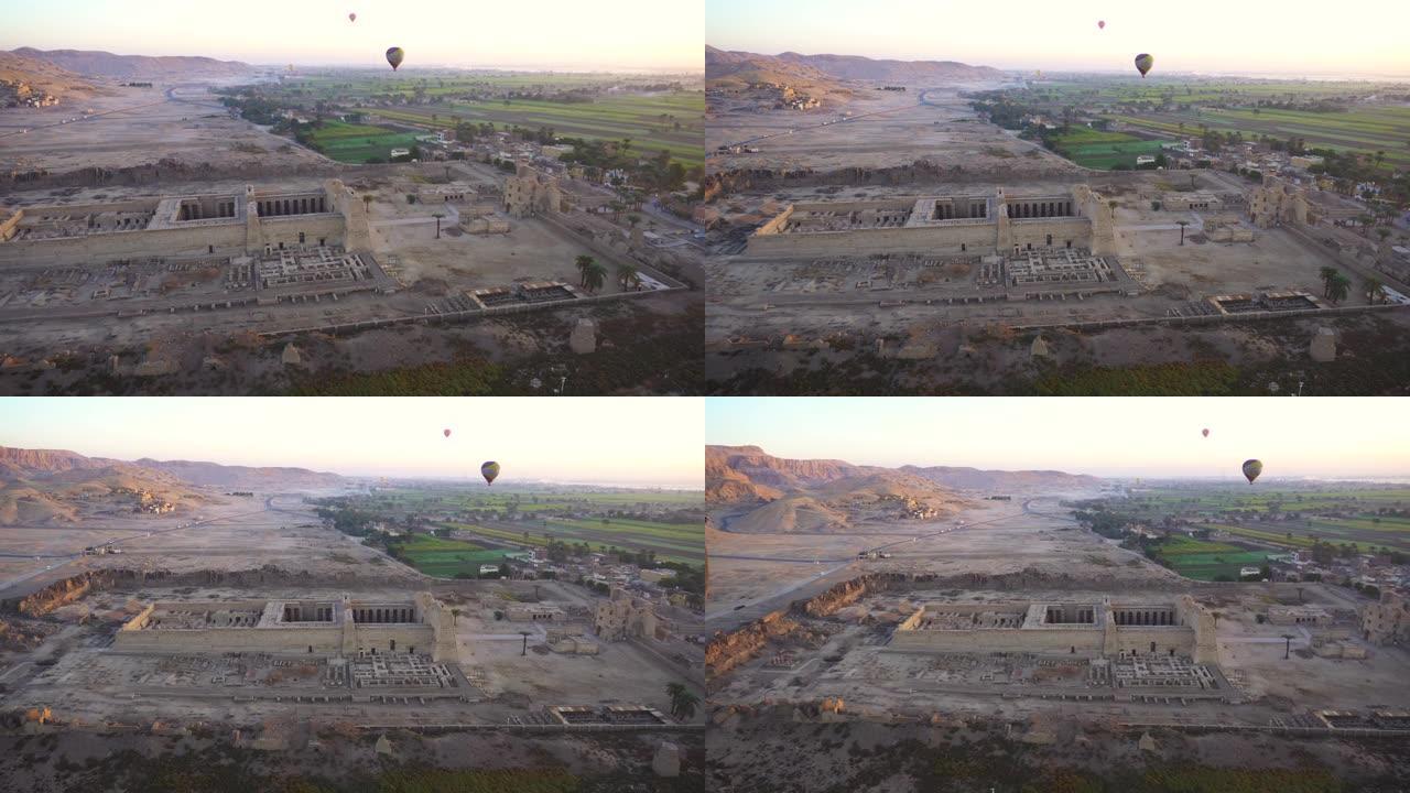来自热气球的鸟瞰图Medinet Habu temple与国王谷天际线背景卢克索埃及