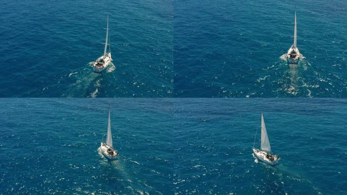 在开阔的海面上航行的游艇。帆船。游艇视频。从上面看游艇。在大风天游艇。游艇。帆船