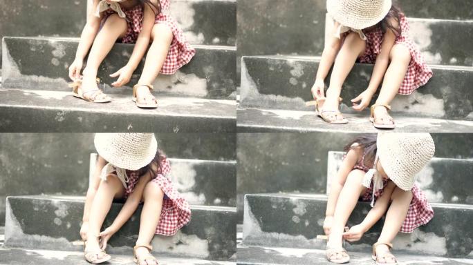 小女孩穿上鞋子