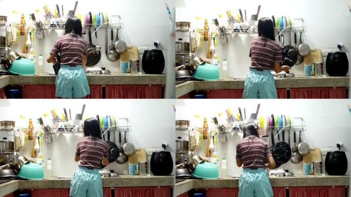 亚洲女孩在家厨房洗碗，家政概念。