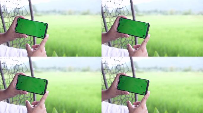 在自然界中使用带有绿屏的智能手机，色键