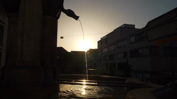 阳光明媚的日落巴塞尔市中心喷泉慢动作全景4k瑞士