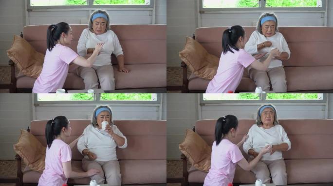 亚洲小女儿给她的老母亲服药。老妈患病有少妇照顾
