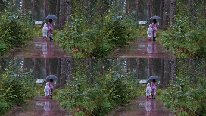 母亲带着女儿在雨天散步