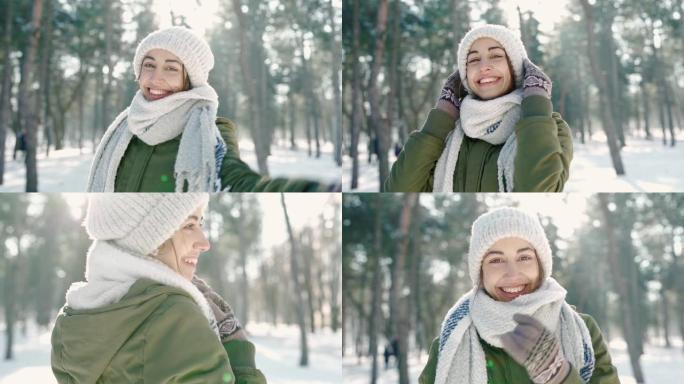 在寒冷的晴天，白雪皑皑的冬季公园里，穿着温暖的羊毛帽和长围巾的美丽大笑的年轻女子的慢动作肖像。女人看
