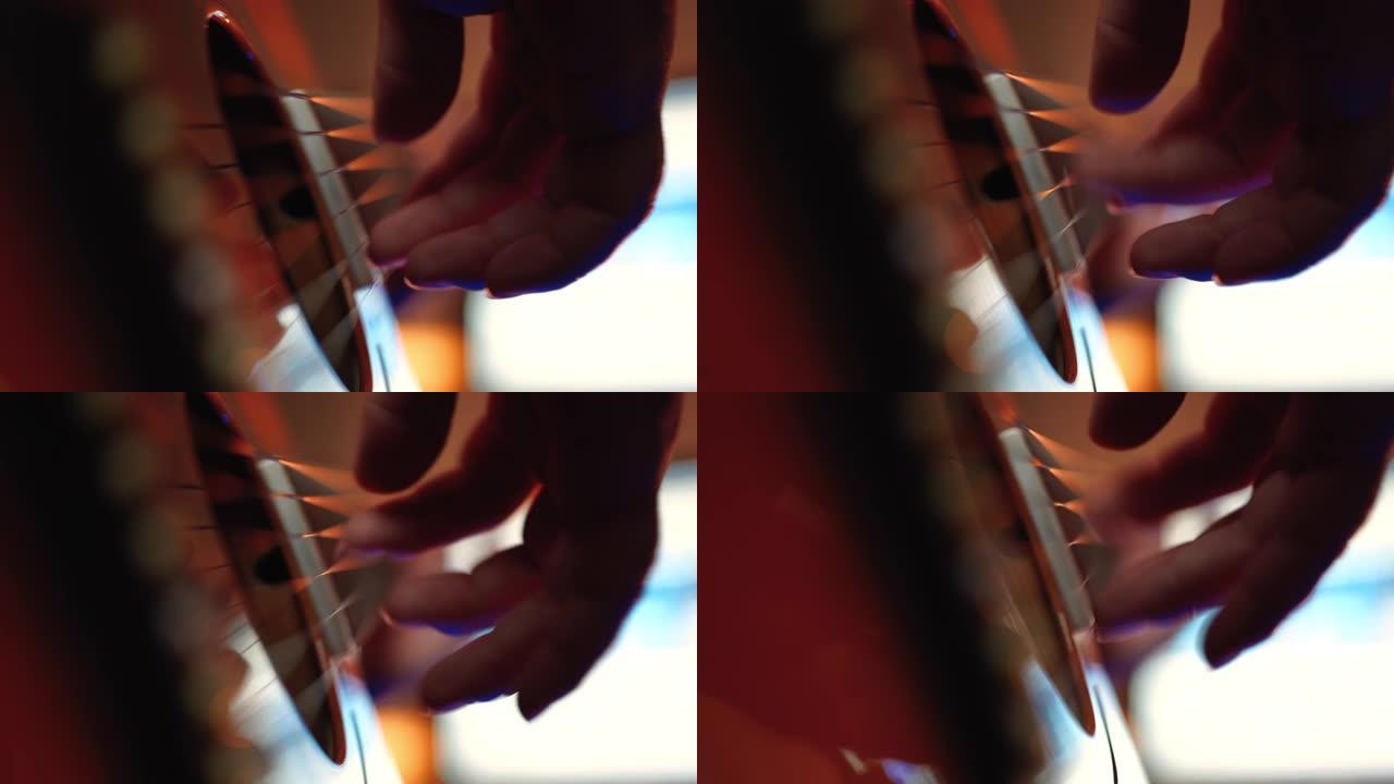 男人的手手指挑选和弹吉他