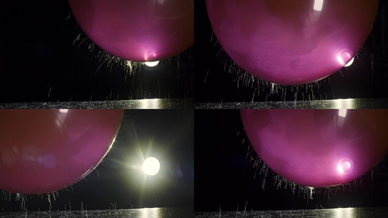 气球中的静电从台面上拾取头发和灰尘 | 4k科学实验