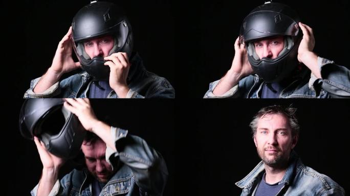 蓝眼睛的中年摩托车手在黑暗的背景下脱下头盔。