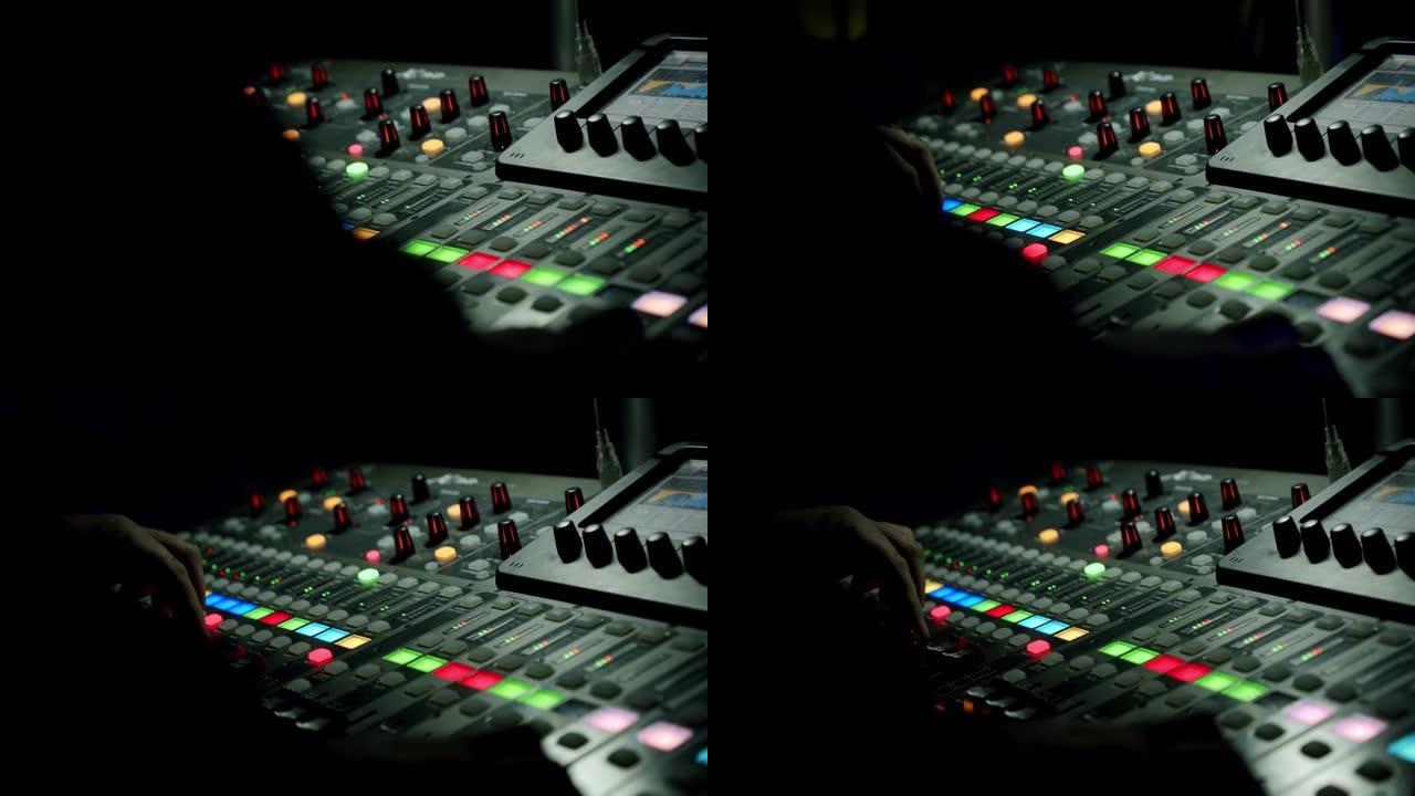 Sound producer hand在音乐会中使用带有编辑工具的音乐混音器。V4
