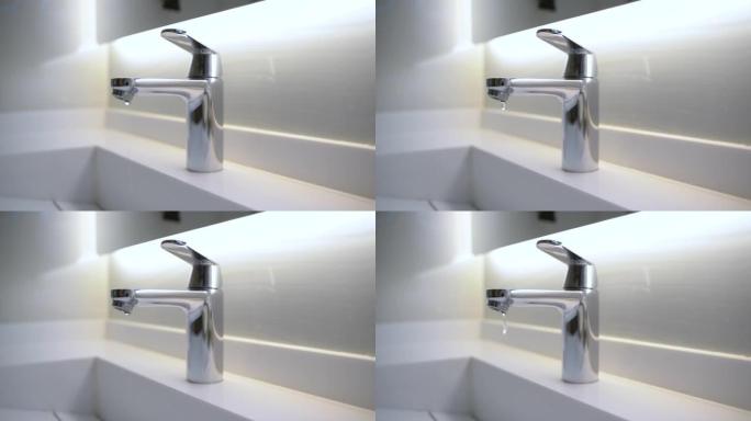 浴室滴水的现代水龙头的4k视频片段