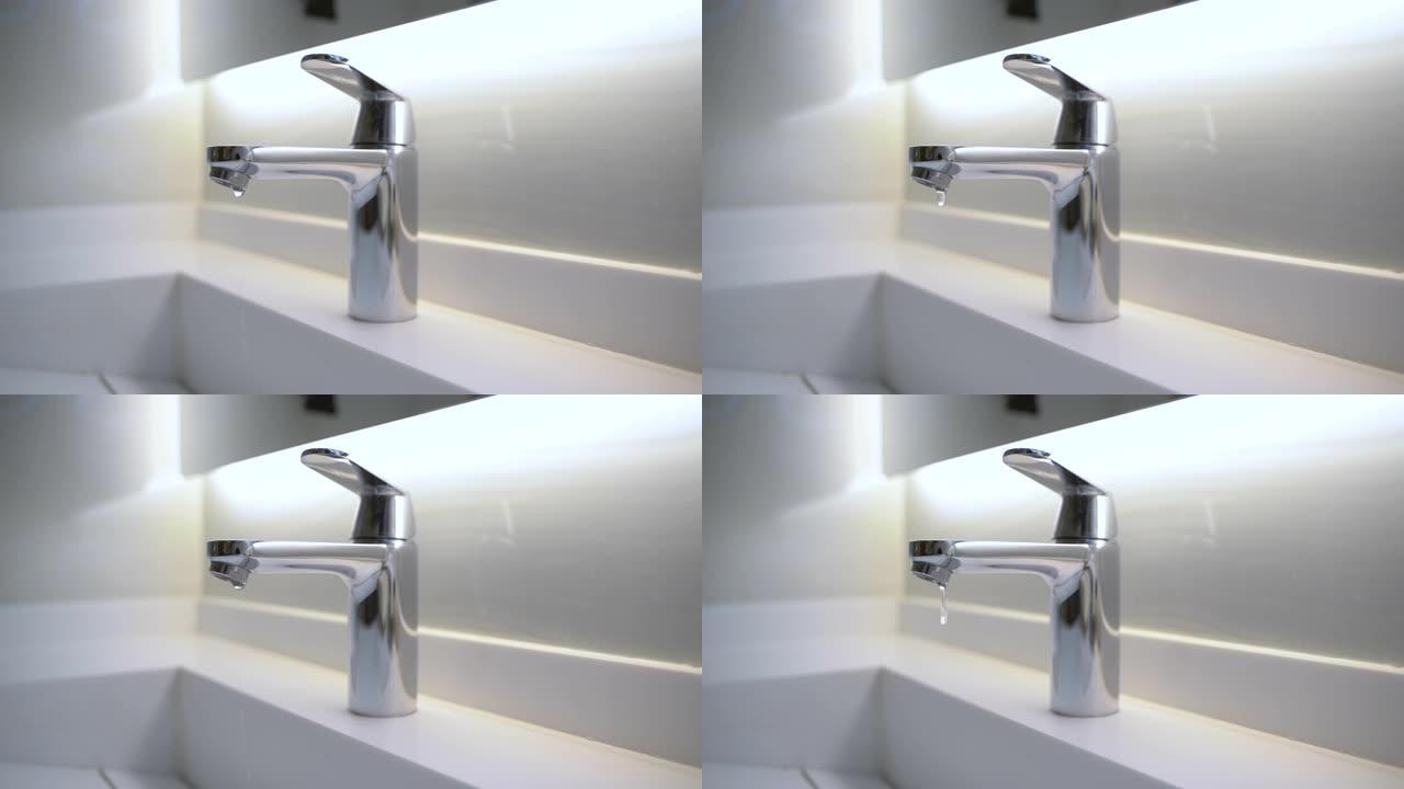 浴室滴水的现代水龙头的4k视频片段