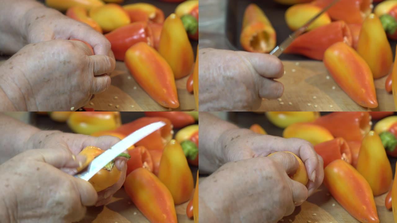 女人切生甜椒去除了顶部和核心，用于烹饪酿辣椒