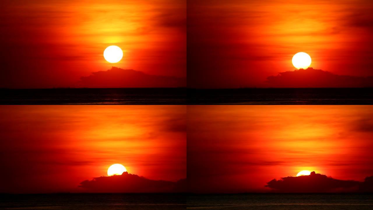 红色橙色天空上的日落回到浅橙色云和黑暗的海洋时间流逝