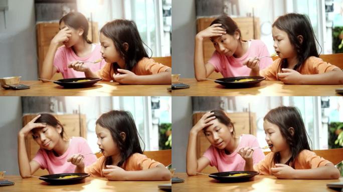 亚洲女孩在家一起吃自制明胶甜食，生活方式理念。