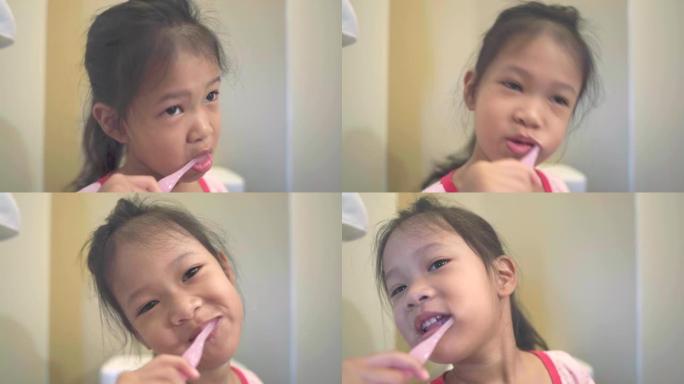 亚洲小女孩在浴室刷牙