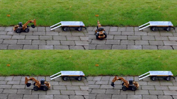 背景上的无线电控制模型挖掘机和拖车视图。自由时间儿童和成人概念。