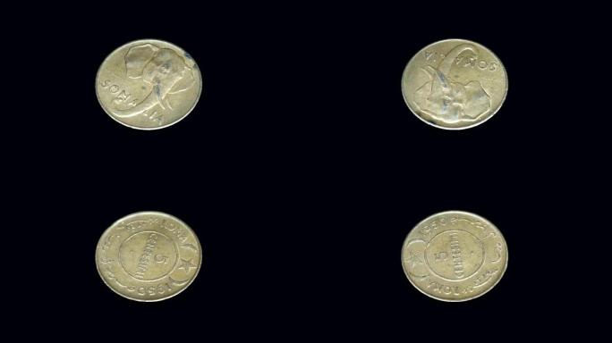 索马里硬币5 centesimi 1950释放在黑色背景上旋转。宏观。特写