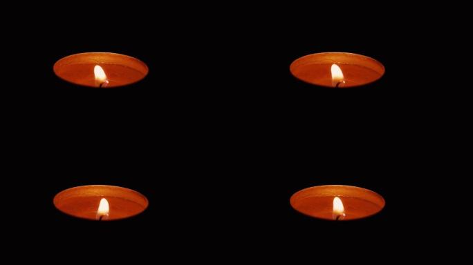 黑暗中圆形蜡烛的光消失了。