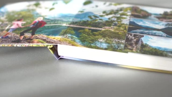 在家里的桌子上翻页写真集