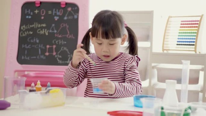 年轻女孩玩彩虹冰科学实验