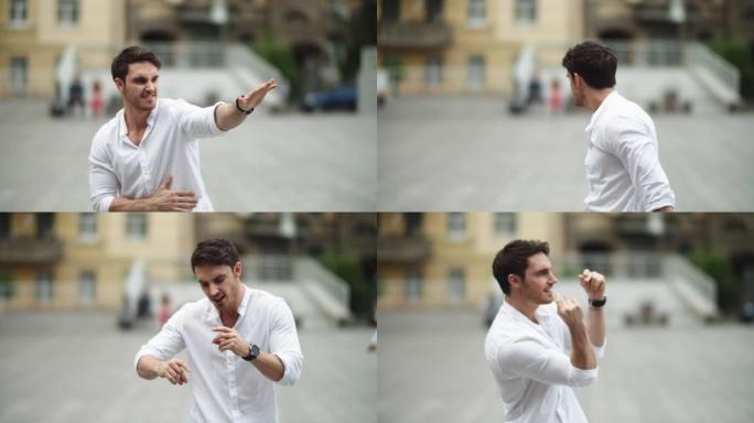 特写镜头男子在街上穿着白衬衫跳舞。好消息后跳舞的家伙