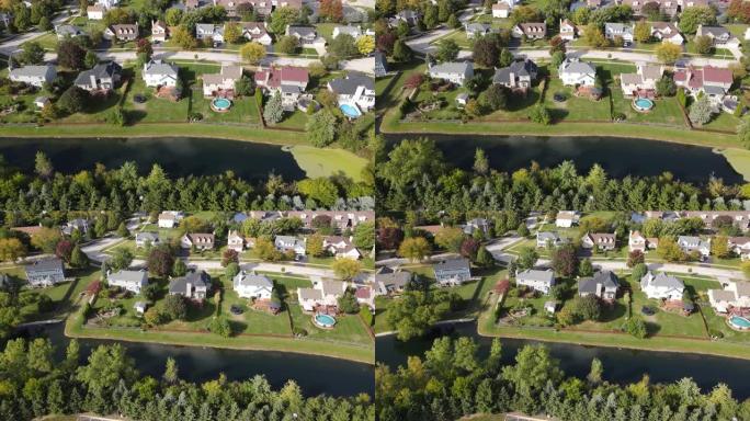 飞越美国一个带排水池的美国郊区社区房屋。4K