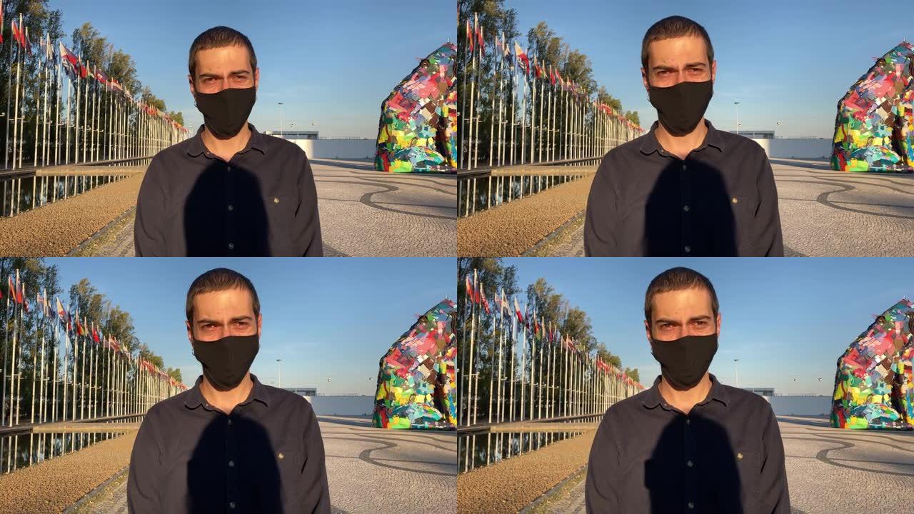 一个戴着口罩的人。一名男子戴着黑色面具对抗新型冠状病毒肺炎第二波