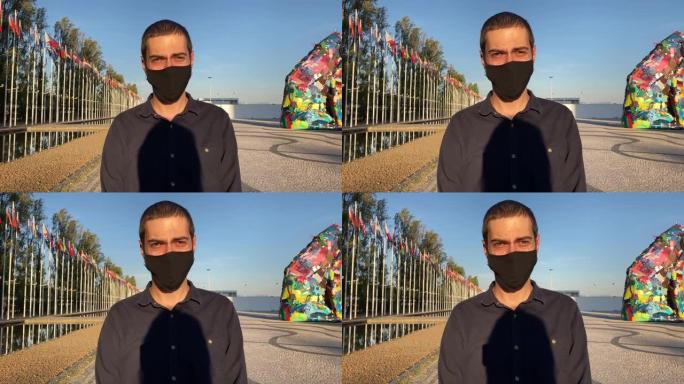 一个戴着口罩的人。一名男子戴着黑色面具对抗新型冠状病毒肺炎第二波