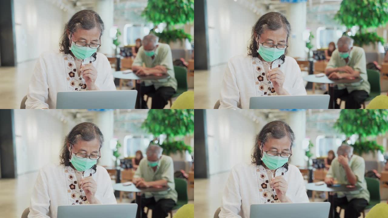 退休高级女商人通过使用计算机进行视频会议与客户交谈