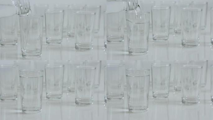 烈酒或白酒倒入透明玻璃杯特写4K