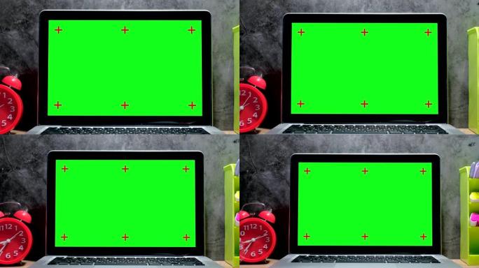 4k缩小现代笔记本电脑的照片，桌面有一个绿色的按键屏幕。