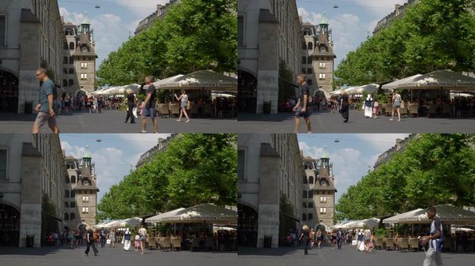 日内瓦市中心晴天著名购物街拥挤广场慢动作全景4k瑞士