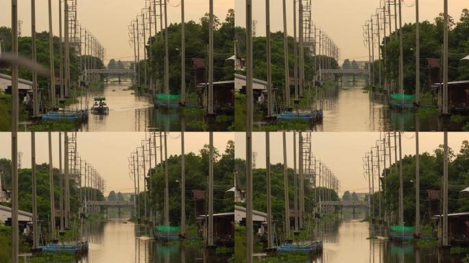 在泰国曼谷，电力技术和工业概念中，电线杆塔和电缆线以及湄南河与日落湖的倒影的时间流逝。