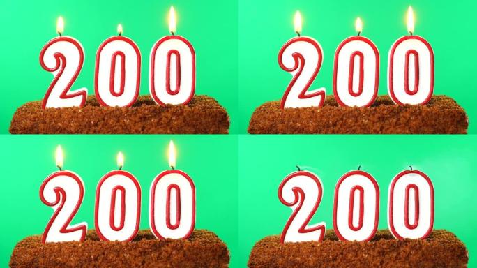 蛋糕与数字200点燃的蜡烛。色度键。绿屏。隔离