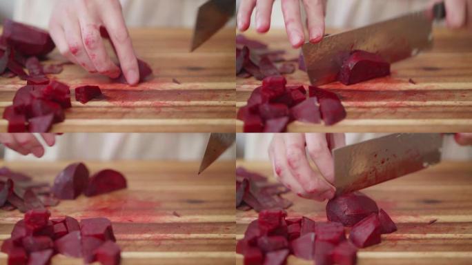 在木制砧板上手工切割甜菜根