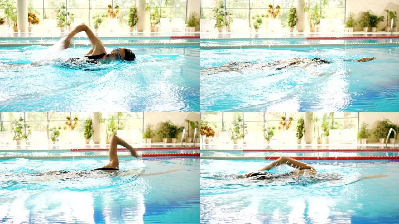 穿着黑色泳衣的女人游泳在游泳池边侧视慢动作