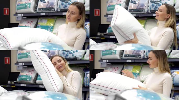 女人在现代家具店为她的床选择合适的枕头