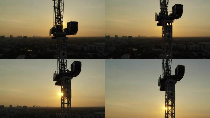 建筑工地工人在日落时攀登建造摩天大楼
